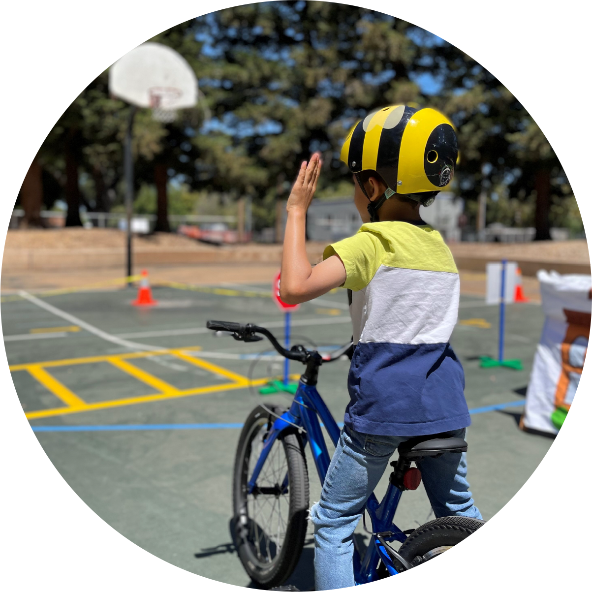 kid on playground with bicycle