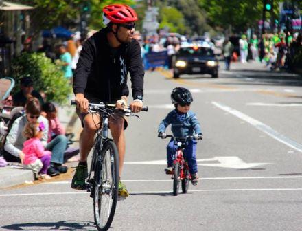 Family biking on street